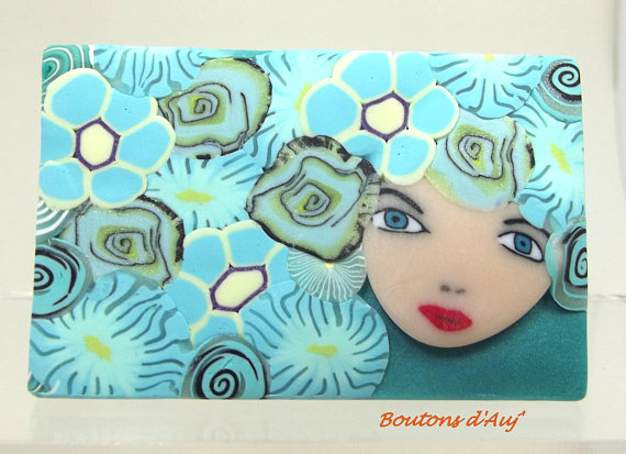 Blue brooch: a girl Liberty. Brooch made of polymer clay and 6 cm x 3.8 cm with a gift bag.