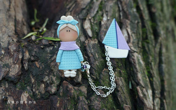 Polymer clay double brooches - dolls with a toy