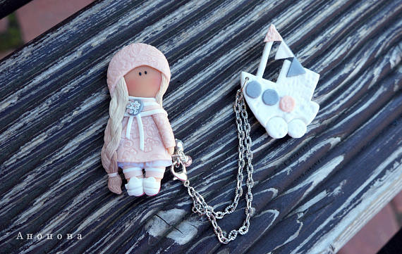 Polymer clay double brooches - dolls with a toy