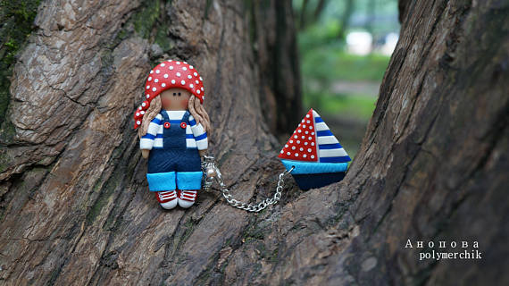 Polymer clay double brooches - dolls with a toy