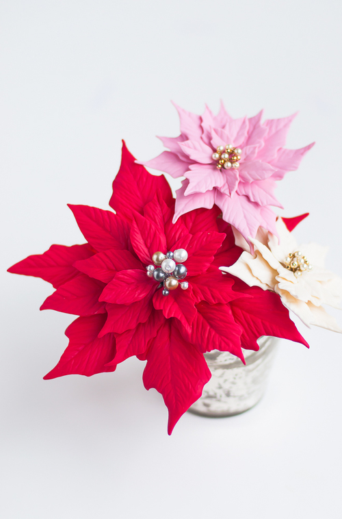 Polymer clay Christmas decorations with poinsettias