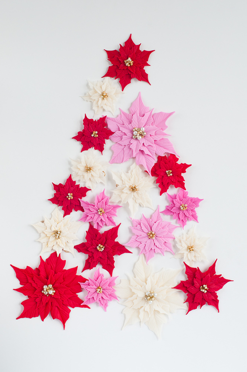 Polymer clay Christmas decorations with poinsettias