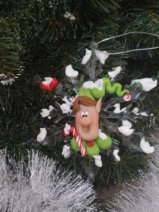 Polymer clay winter figurines on acrylic snowflakes