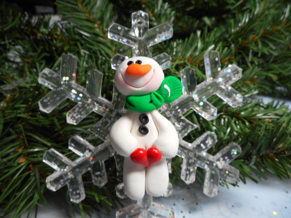 Polymer clay winter figurines on acrylic snowflakes