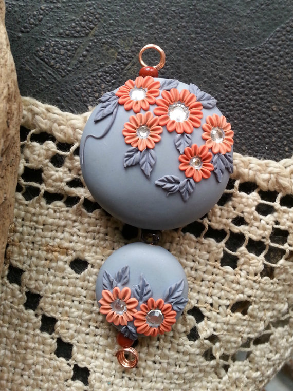 bead set with backgrounds of dove grey  and flowers and leaves in shades of coral/dark grey.