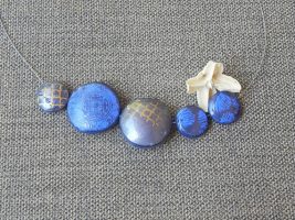 Check this One of a kind polymer clay blue and gold necklace, you might like it!