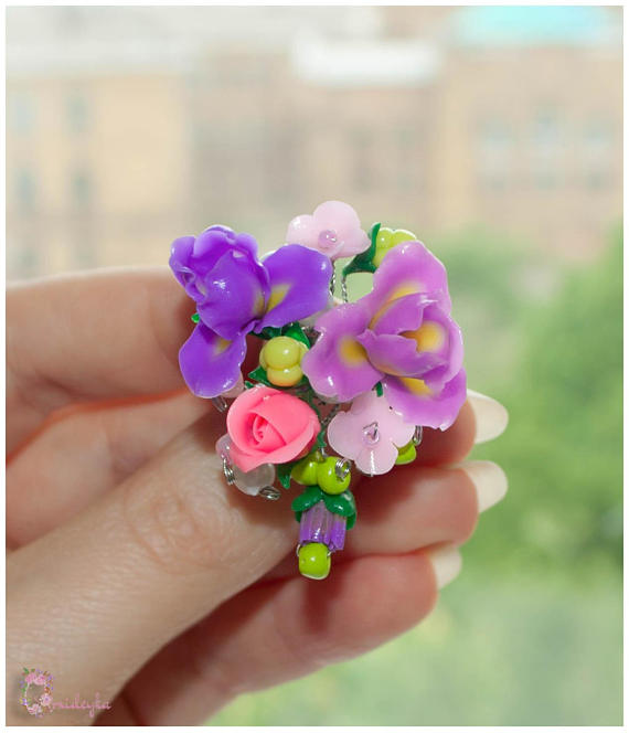 Exclusive handmade ring with bright pink roses, lilac irises, light pink lilac flowers and green cloud berries.