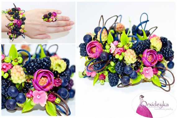 Lovely handmade bracelet with forest berries and purple ranunculus.