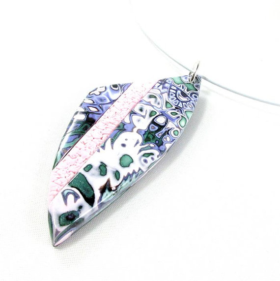 Polymer clay pendant in mokume gane technique: purple, green and pink.