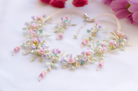 Polymer clay flower necklace with tender drop roses, ivory leaves tinted with pistachio hues and pretty tiny flowers like lilacs and hydrangea. Polymer clay floral necklace ideas