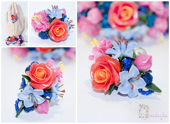 Exclusive handmade flower ring with gorgeous floral bouquet of warm red rose, pink and pale blue flowers, cold green leaves and navy blue beads.