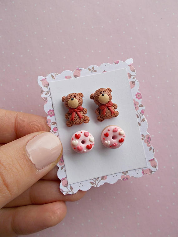 set of two pairs of earrings created from polymer clay without molds or forms with 2 teddy bears and 2 donuts decorated with pink and red hearts