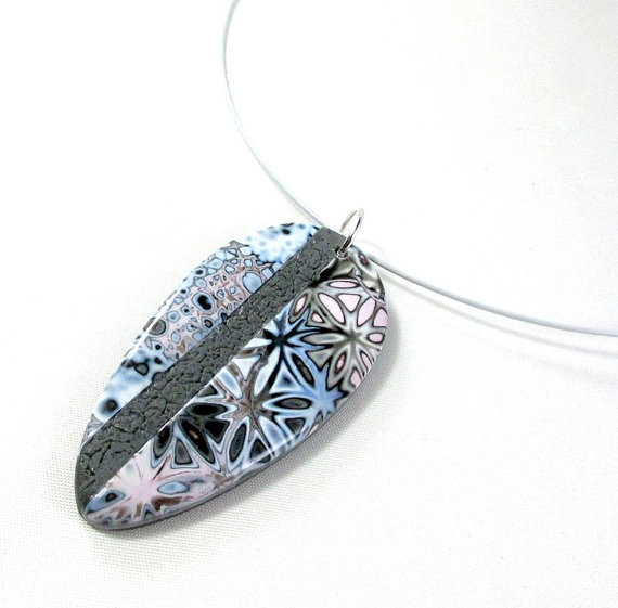 Lovely polymer clay pendant in mokume gane technique with graphic pattern in soft colors: gray, blue, pink.