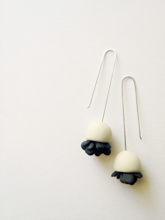minimalistic hand sculped bell flower polymer clay earrings in off white colour with black elements