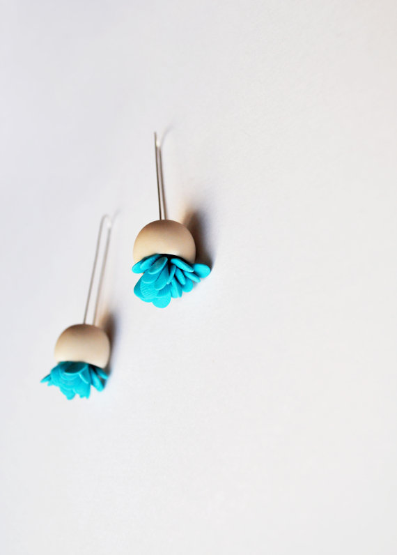 minimalistic hand sculpted bell flower polymer clay earrings in off white colour with teal elements