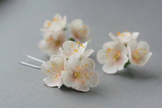 Beautiful tender flower hair pins with blossom apple flowers are made from Japanese air dry clay